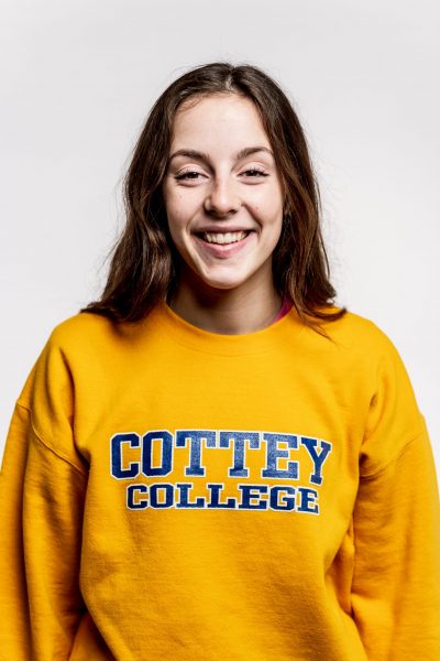Smiling college student in Cottey College sweatshirt