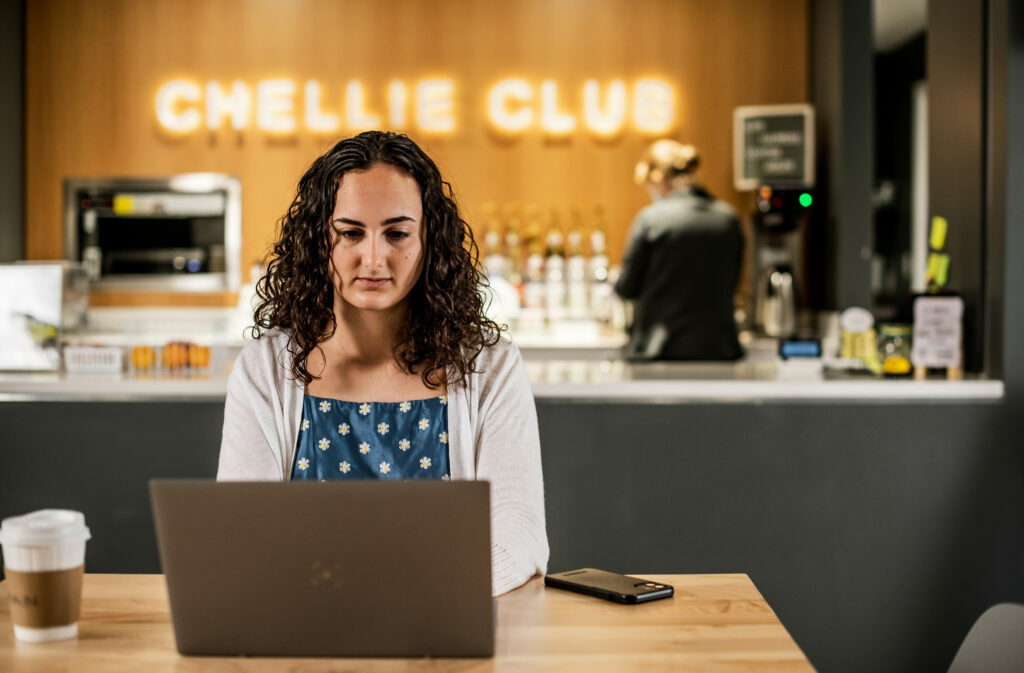 Student Studying on laptop in Cottey Coffee Shop