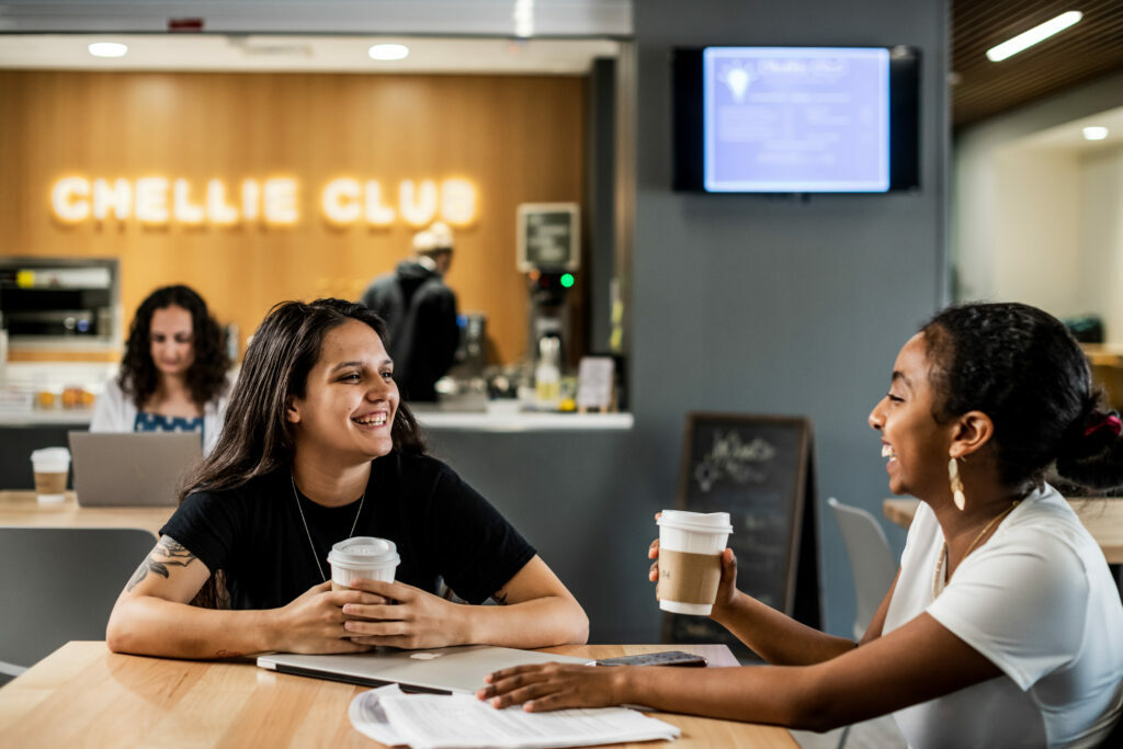 Students laughing in Cottey's Chellie Club coffee shop