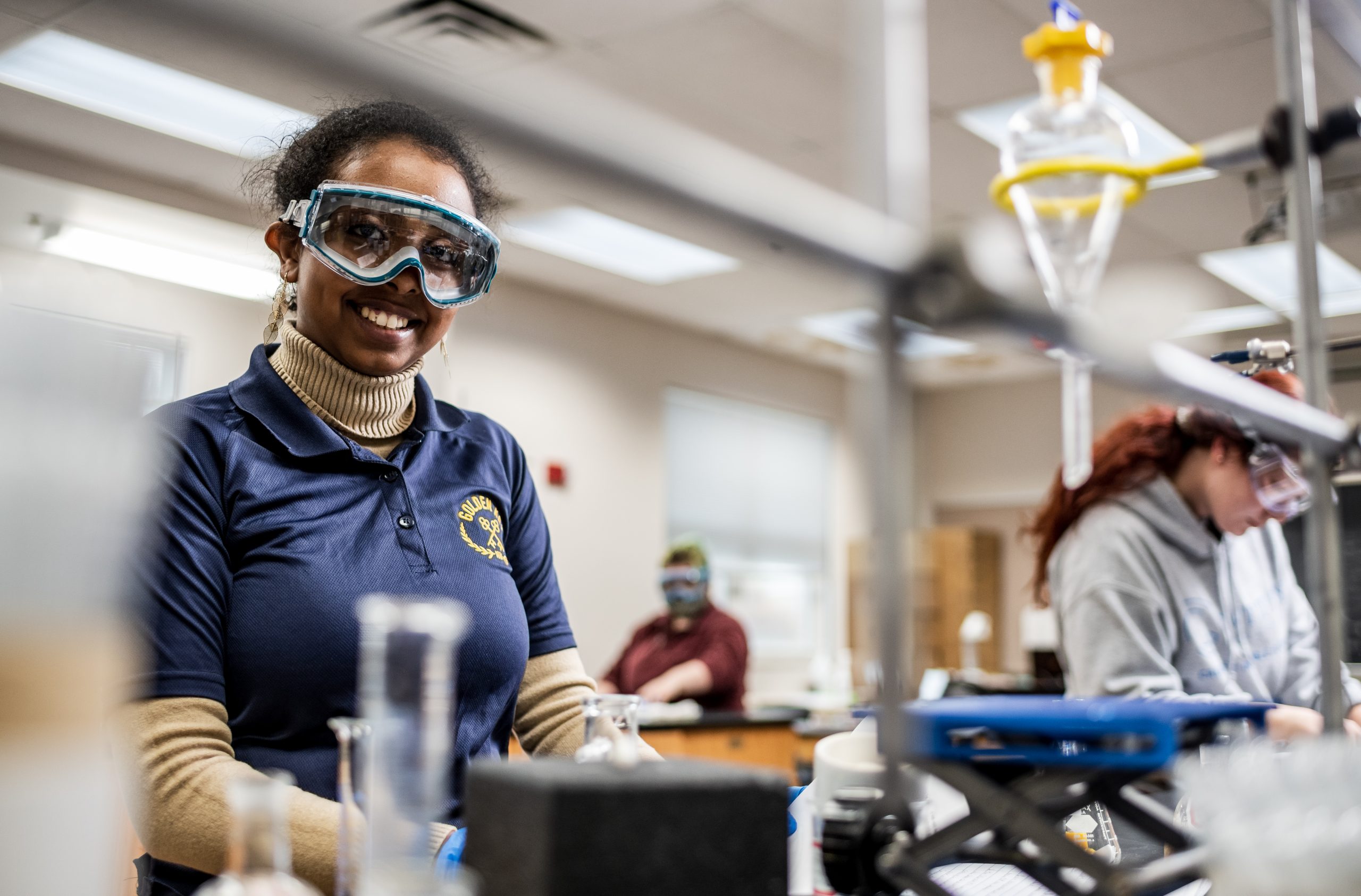 Cottey College student doing hands-on experiment in chemistry lab