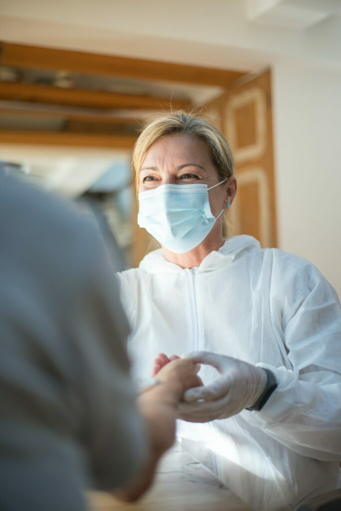 Health care worker wearing a mask and clean suite