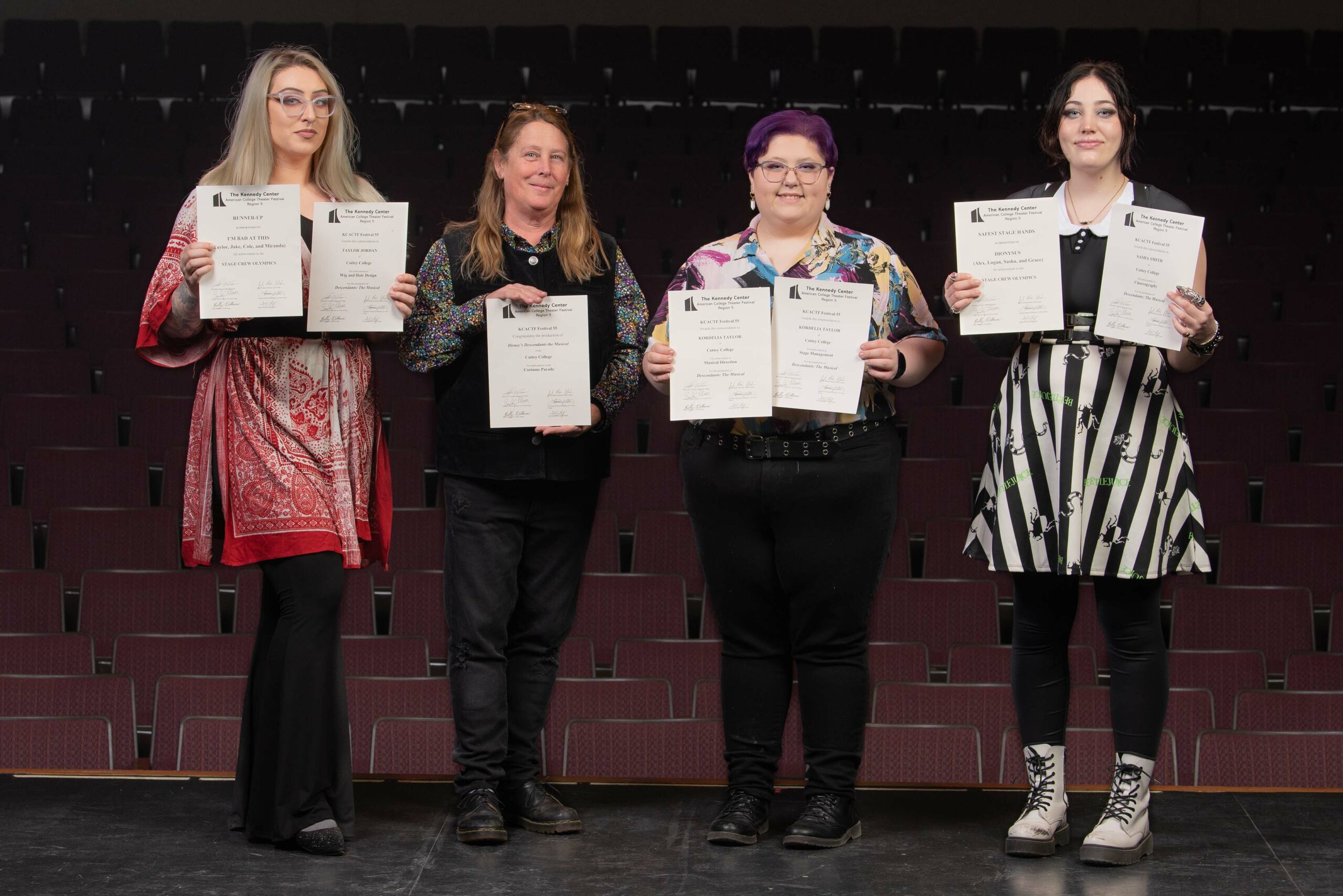 Cottey Theatre Students Holding Awards On Stage