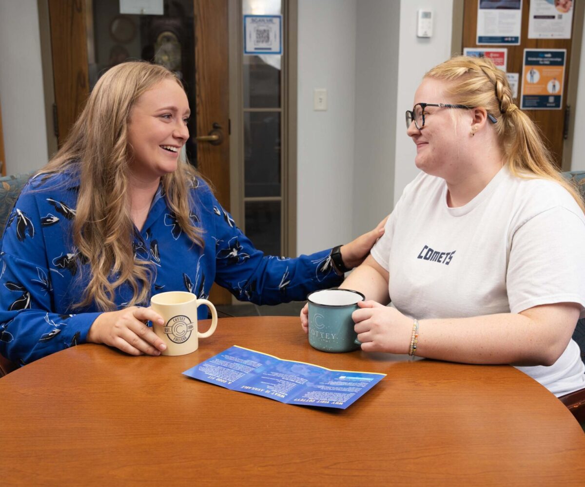 Cottey's financial aid director conversing with an interested student.
