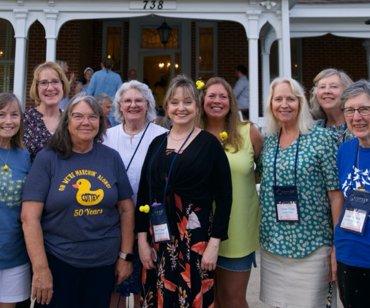 A group of Vacation College attendees posing together in front of the Cottey College President's house.