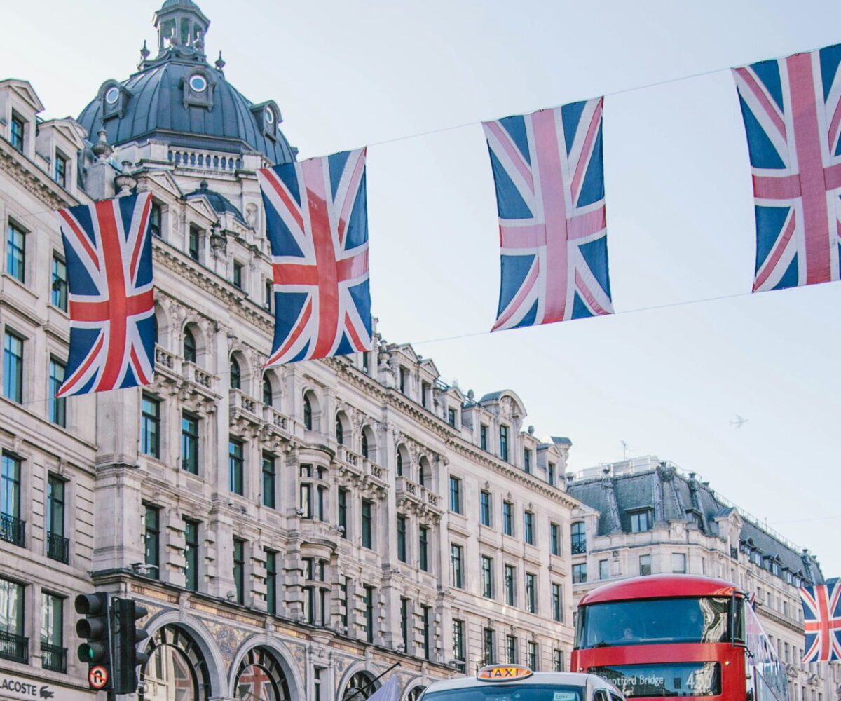 The streets of London, including traffic and stately buildings.