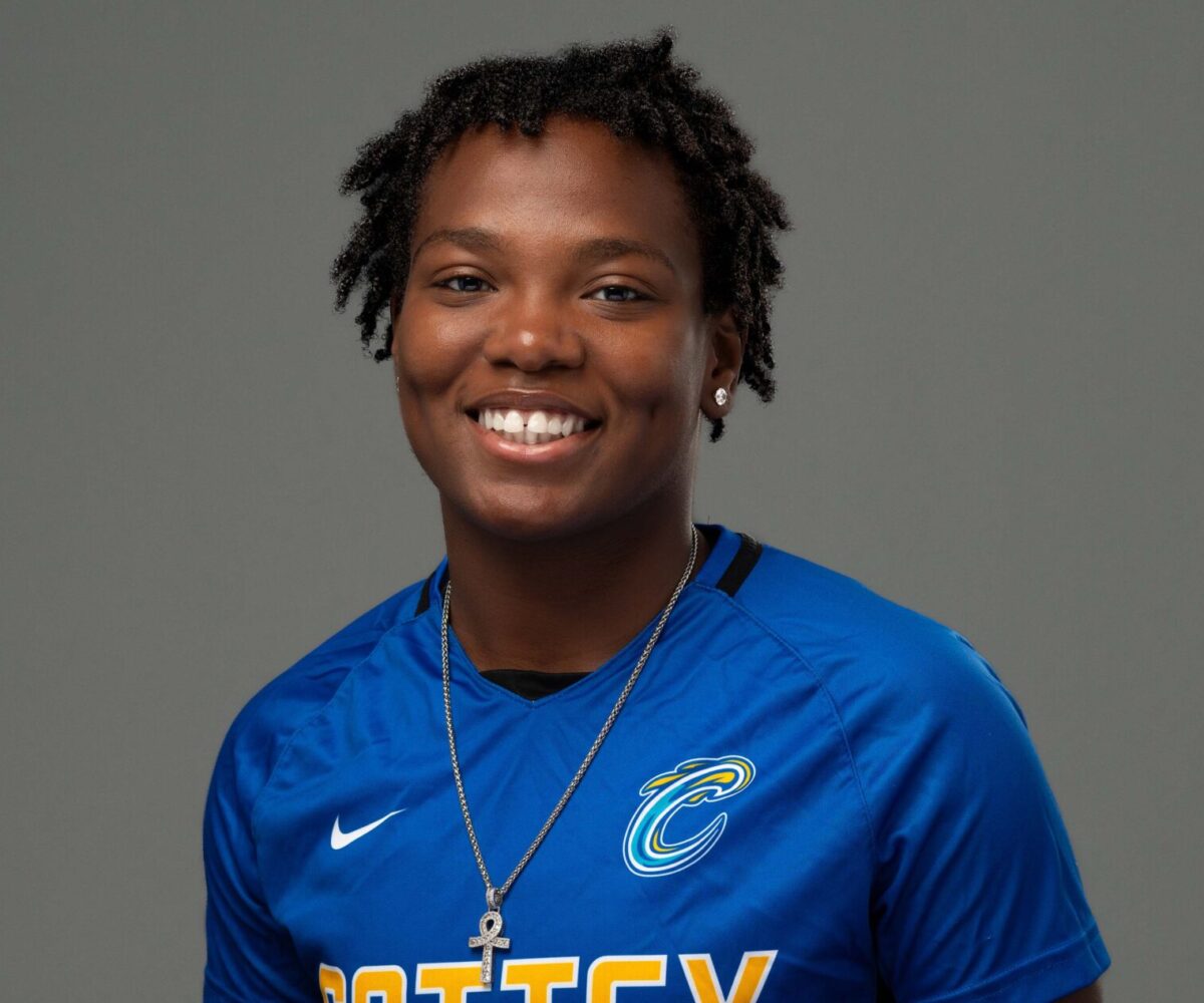 I Cottey athlete wearing a football jersey and smiling into the camera.