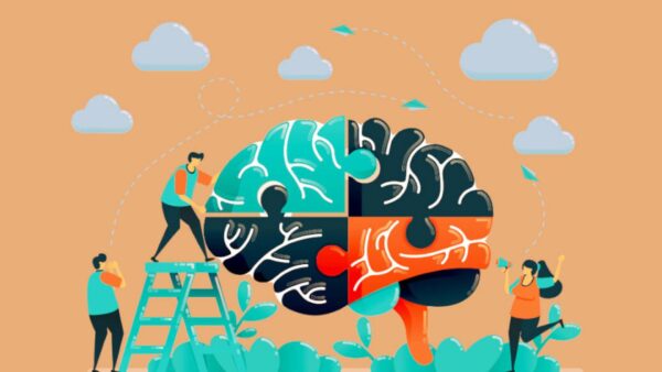 People putting together a giant brain puzzle.