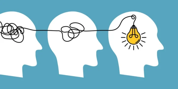 An illustration of three empty heads, one containing a light bulb.