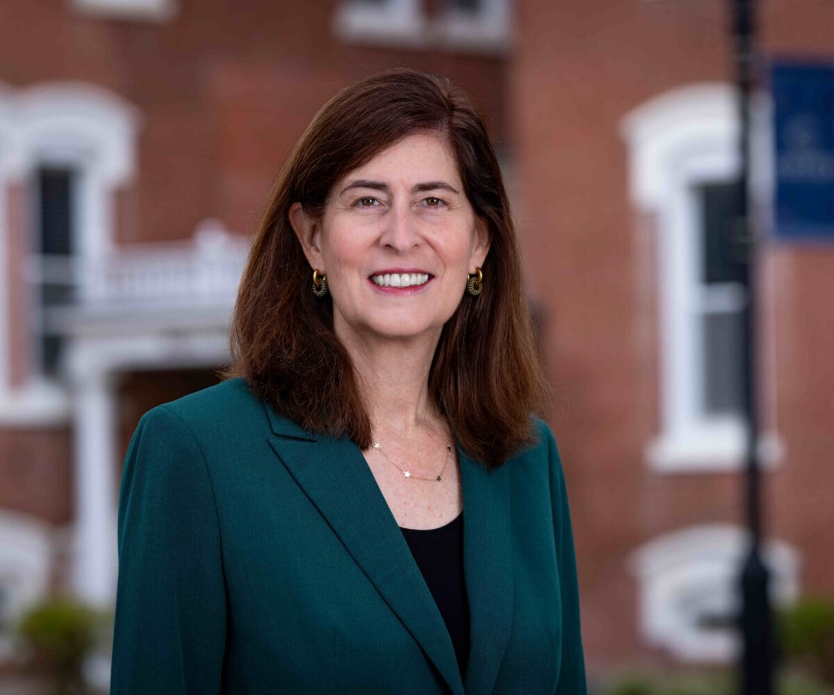 Woman in a suit smiling